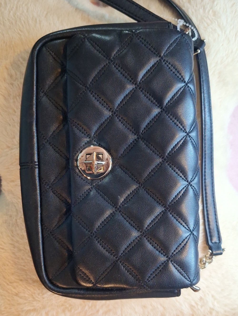 Kate Spade Black Quilted Crossbody Bag with Turn-Lock Accent.